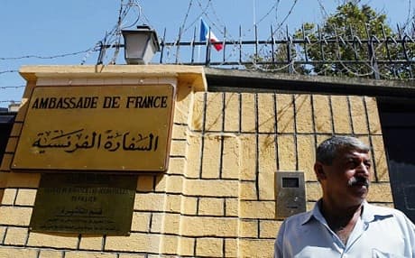 A guard walks in front of the French embassy that opened July 13, 2004 in Baghdad, Iraq. File photo: Joe Raedle | AFP 