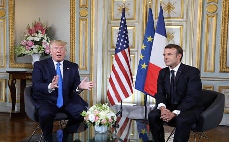 US President Donald Trump (left) and French President Emmanuel Macron speak during a meeting at the Prefecture of Caen, Normandy, France, on June 6, 2019. Photo: Ludovic Marin | AFP