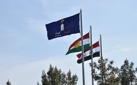 The flags of Gorran, the Kurdistan Region, and Iraq fly above the city of Sulaimani, Kurdistan Region. File photo: Gorran