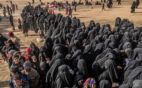 Civilians evacuated from Baghouz wait at a screening area held by the US-backed Kurdish-led Syrian Democratic Forces (SDF) on March 5, 2019. File photo: Bulent Kilic / AFP