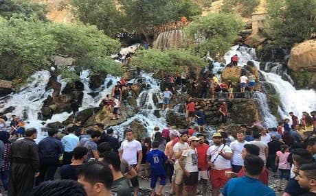 Throngs of summer tourists visiting Bekhal waterfall in 2017.