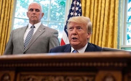 US President Donald Trump speaks to the press as Vice President Mike Pence looks on in the Oval Office at the White House in Washington, DC, on July 1, 2019. Photo: Nicholas Kamm | AFP