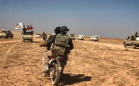 Fighters carrying the Iraqi and Hashd al-Shaabi flags travel in a photo posted on June 30, 2019. Photo: al-Hashed FB