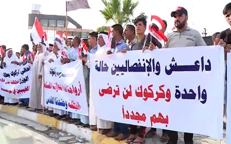 Protesters gather in Kirkuk on July 12, 2019. The sign reads “ISIS [Islamic State] and separatists are the same.”  