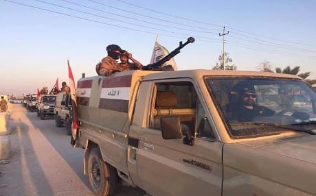 Hashd al-Shaabi fighters drive in a convoy in Iraq in an image posted on June 30, 2019. File photo: Hashd FB