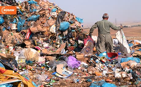 A man collects garbage at a waste dump in Kurdistan. Photo: Rudaw
