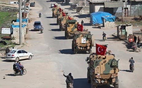 Armored Turkish military vehicles patrol a road in the de-militarized zone in Syria's northern Idlib province on March 8, 2019. Photo: AFP / Omar Haj Kadour