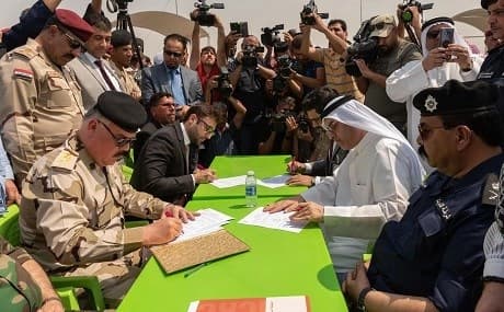 Iraqi officials hand over the remains of Kuwaiti prisoners of war at the Abdali border crossing in Iraq’s southern province of Basra, August 8, 2019. Photo: Abdullah al-Mesri / KUNA