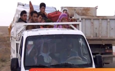 A Yezidi family flees the latest violence. Photo: Rudaw