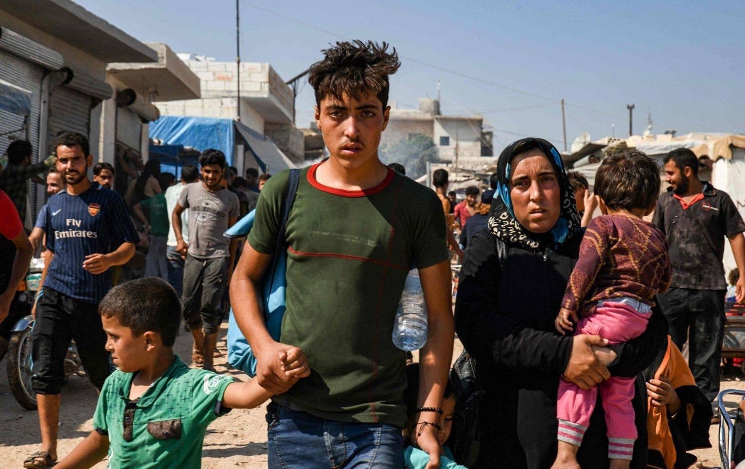 Syrians protesting at the Turkish border with Syria's Idlib province on August 30, 2019. Photo: AFP