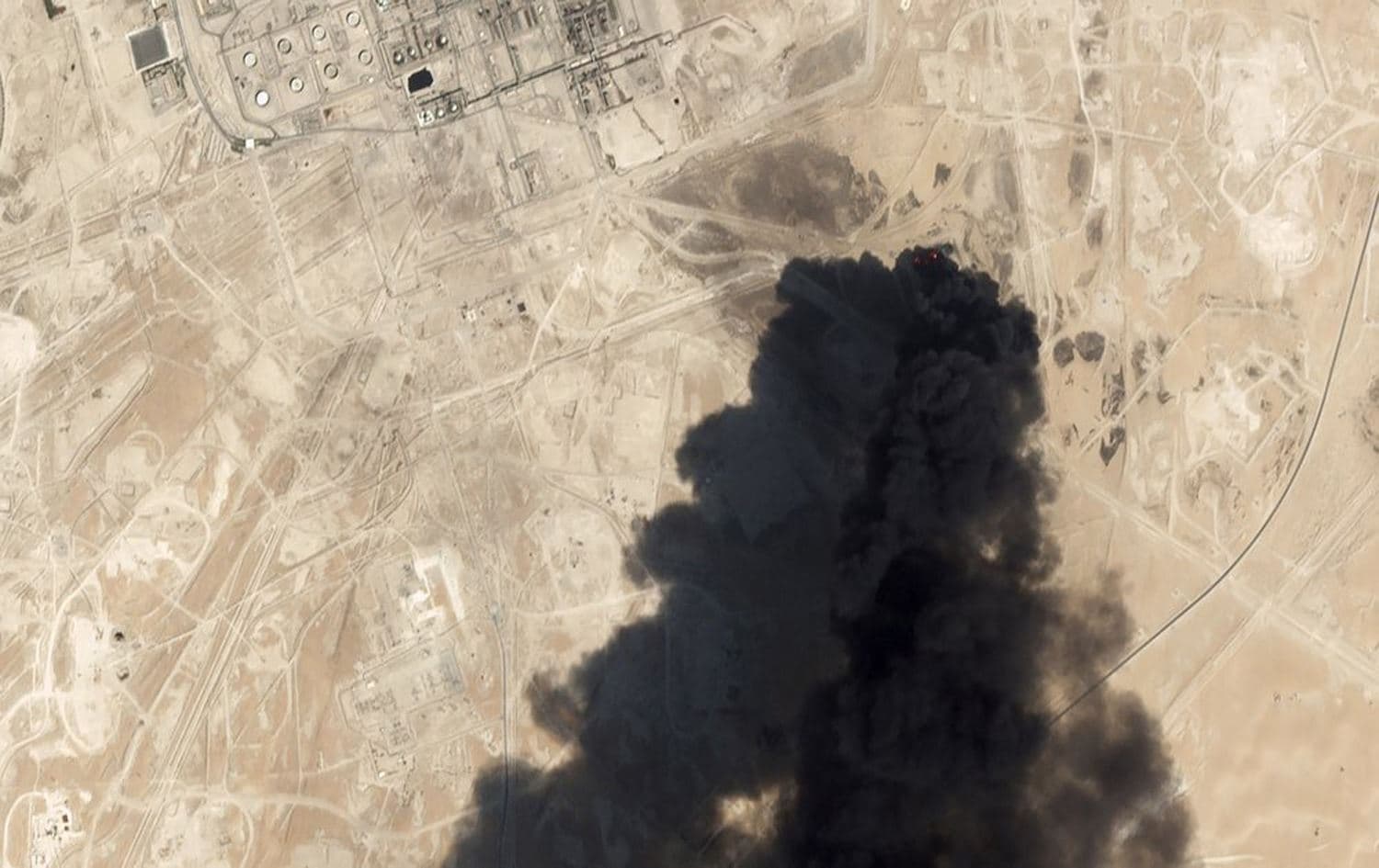 Satellite image shows thick black smoke rising from Saudi Aramco's Abqaiq oil processing facility in Buqyaq, Saudi Arabia, September 14, 2019. Photo: Planet Labs Inc / AP 