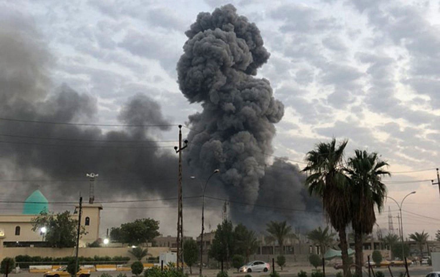  Smoke rises after an explosion at al-Saqr military base, belonging to Hashd al-Shaabi (Popular Mobilization Forces, PMF), in the Dora neighborhood of Baghdad on August 13, 2019. Photo: Loay Hameed / AP