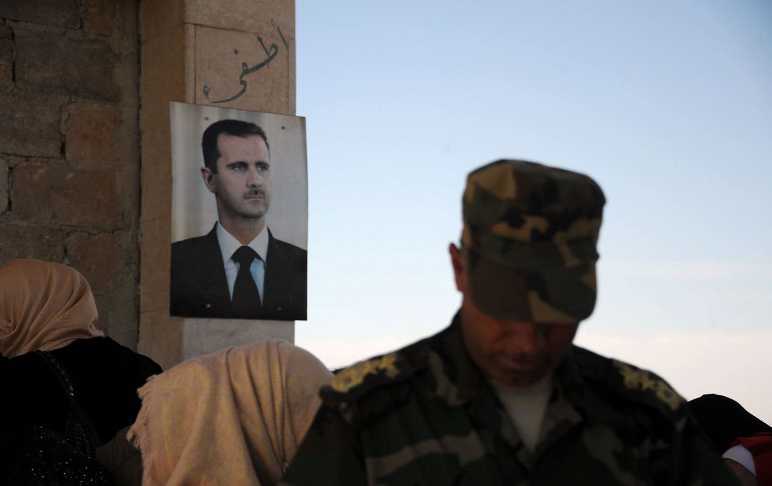 A portrait of Syrian President Bashar al-Assad is seen outside the Suran crossing point, close to the Syrian-Turkish border, September 25, 2019. Photo: Maxime Popov / AFP 