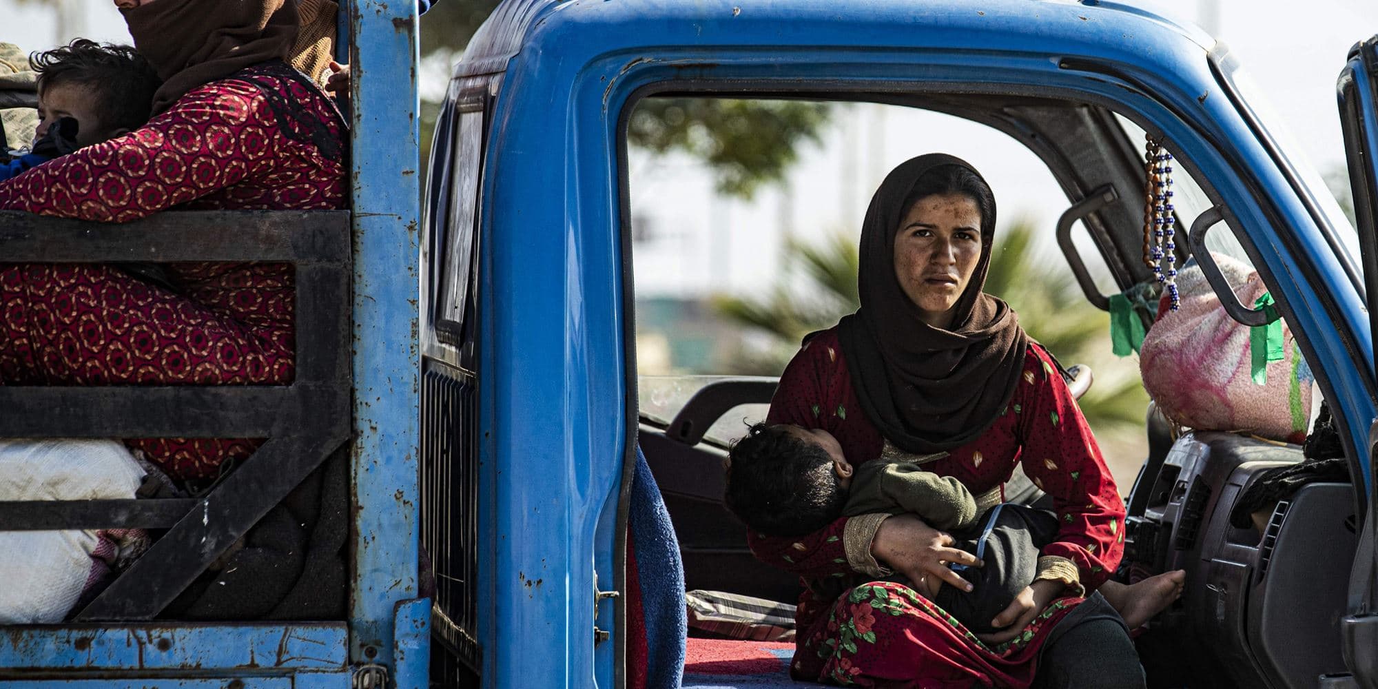 Syrian families fleeing the battle zone between Turkey-led forces and Kurdish fighters from the Syrian Democratic Forces (SDF)  on the outskirts of Hasakeh on October 15, 2019. Photo:Delil Souleiman/AFP