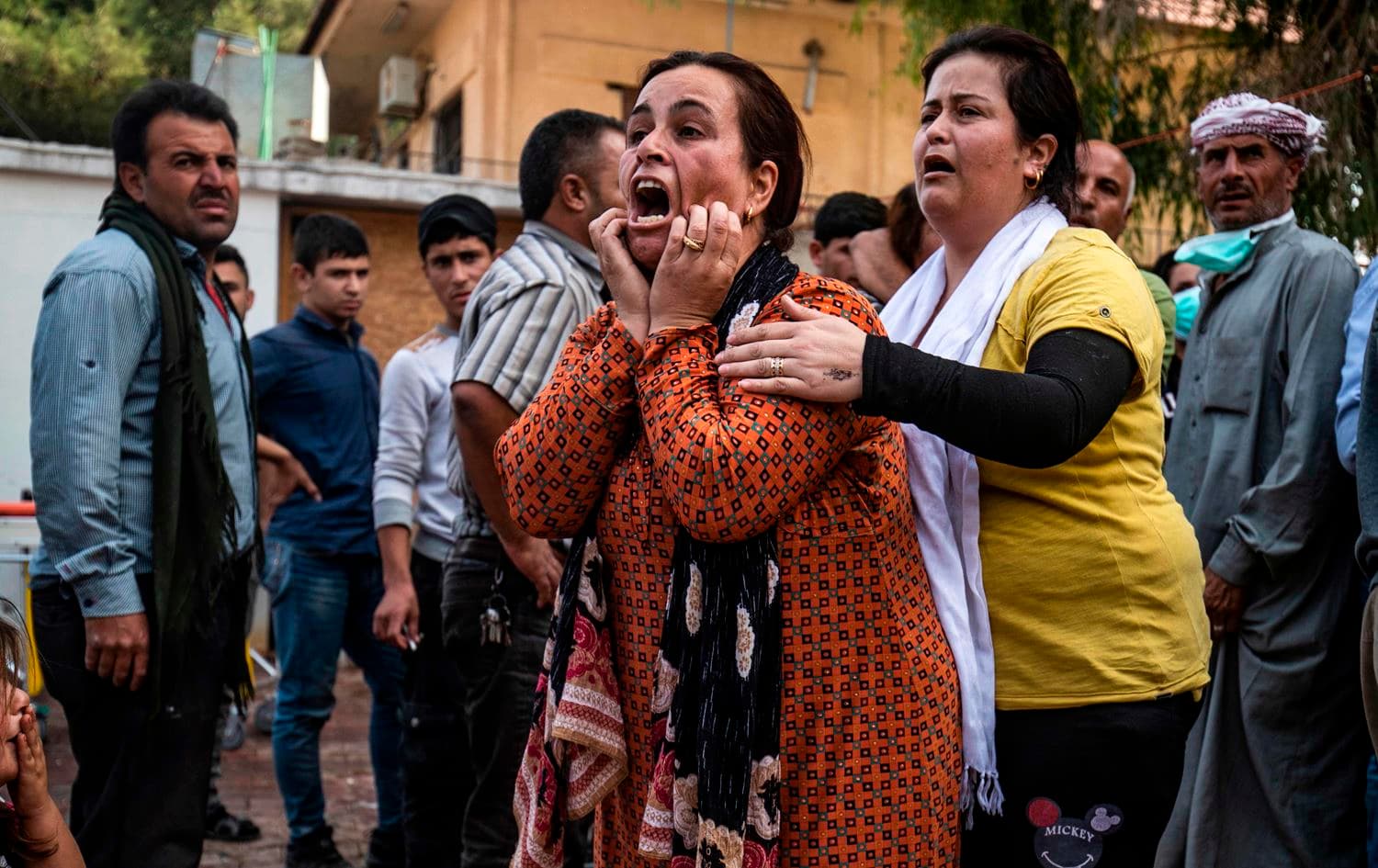 A woman reacts as the body of a man killed during Turkish shelling in the area surrounding the Syrian Kurdish town of Ras al-Ain arrives at a hospital in the nearby town of Tal Tamr following the announced ceasefire on October 18, 2019. Photo: Delil Souleiman/AFP