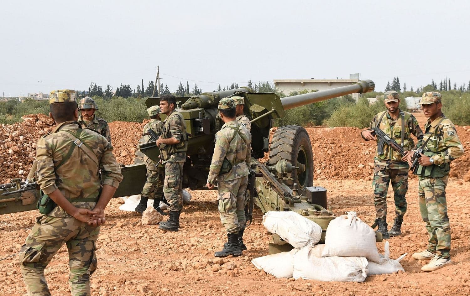 A handout picture released by the official Syrian Arab News Agency (SANA) on October 21, 2019 shows Syrian Arab Army units deploying in the northern city of Manbij, near the Turkish border. Photo: AFP/SANA