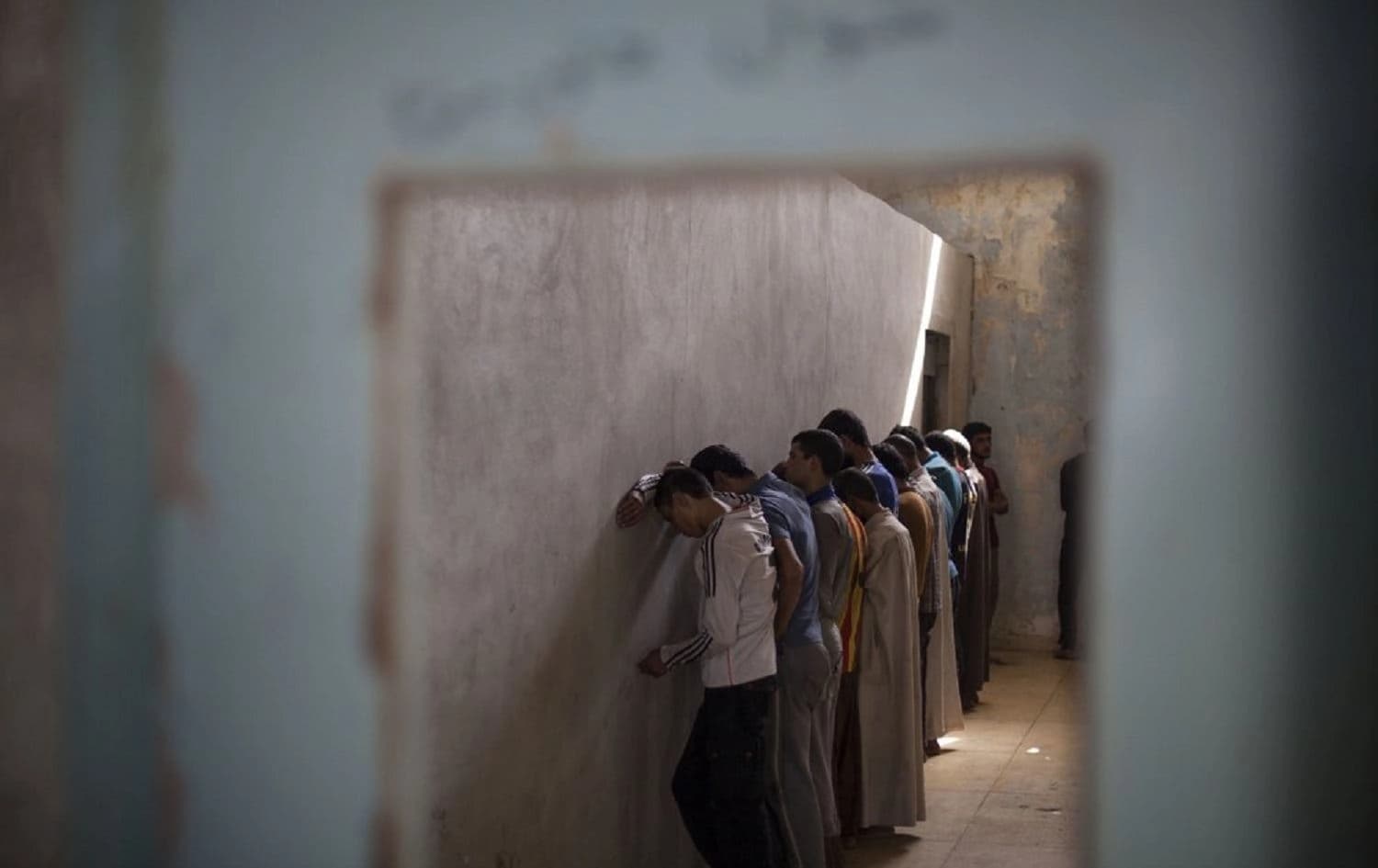 Suspected ISIS members at a Kurdish screening center in Dibis, October 3, 2017. Photo: Bram Janssen/AFP