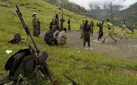 PJAK fighters playing volleyball in their Qandil Mountain bases across the border from Iran. Photo: AFP