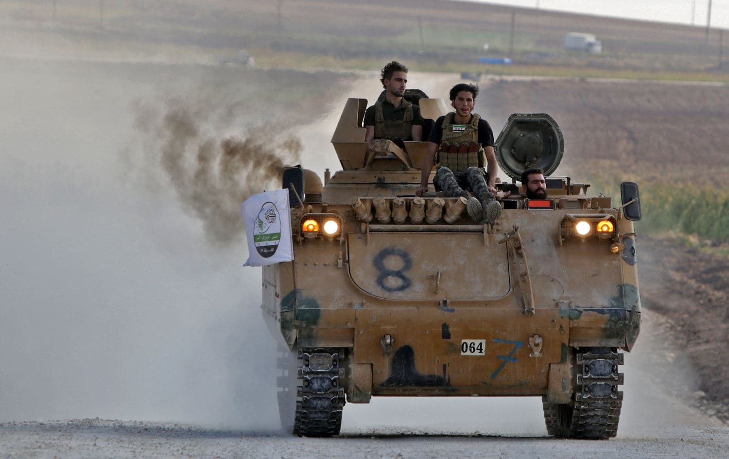 Turkish-backed Syrian fighters patrol the Syria-Turkey border town of Tal Abyad on October 31, 2019. Photo: AFP / Bakr Alkasem