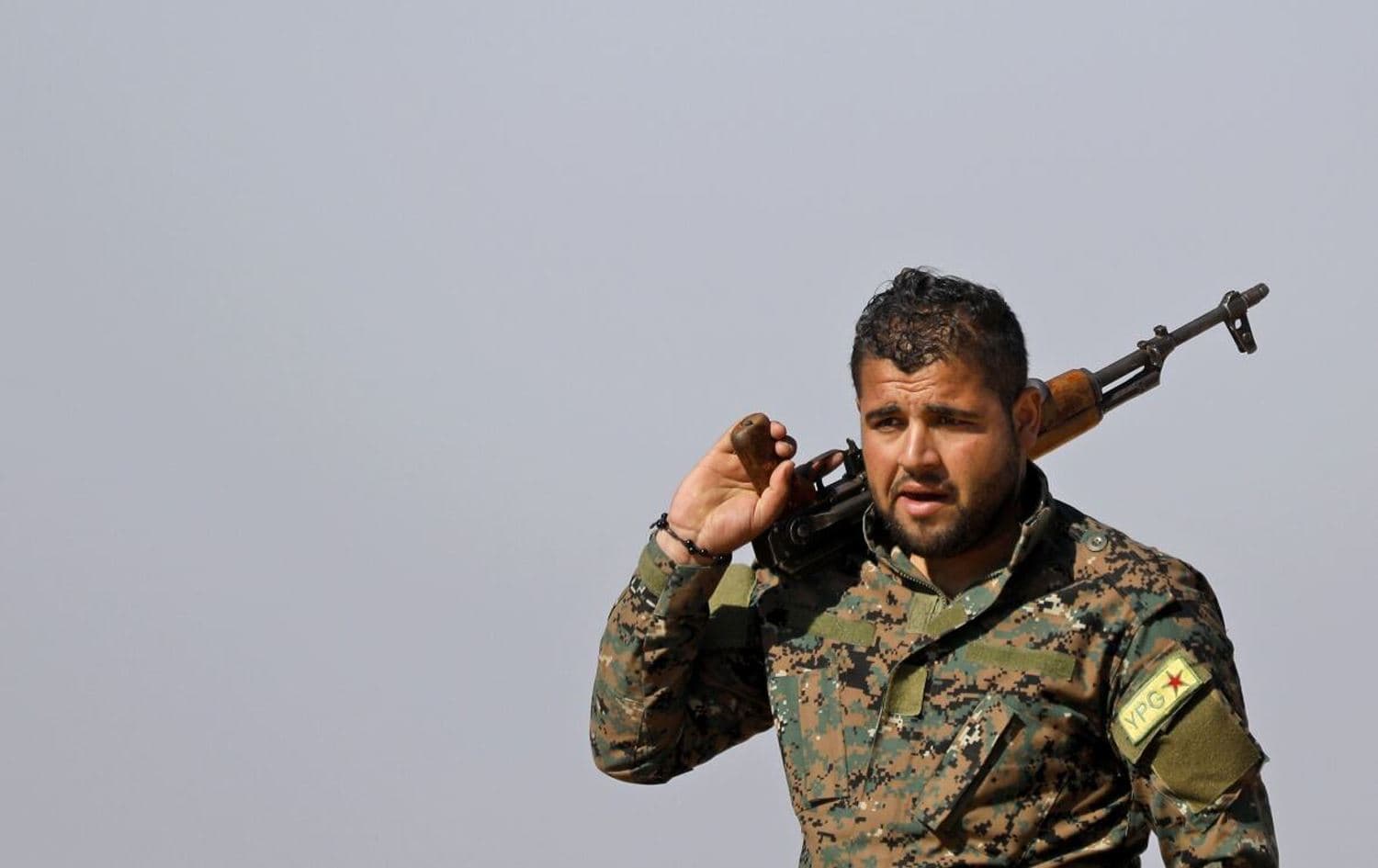 A YPG fighter stands with his rifle in this February 12 photo. File photo: Delil Souleiman/AFP