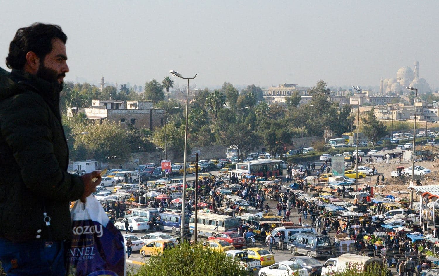 An Iraqi man looks down on Mosul's Prophet Yunus (Jonas) market, November 25, 2019. Photo: Zaid al-Obeidi / AFP 