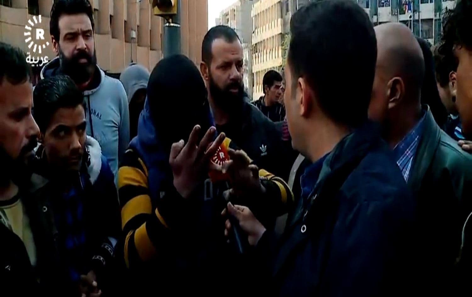 Masked protesters spoke to Rudaw following the killing in Wathba Square. Photo: Rudaw
