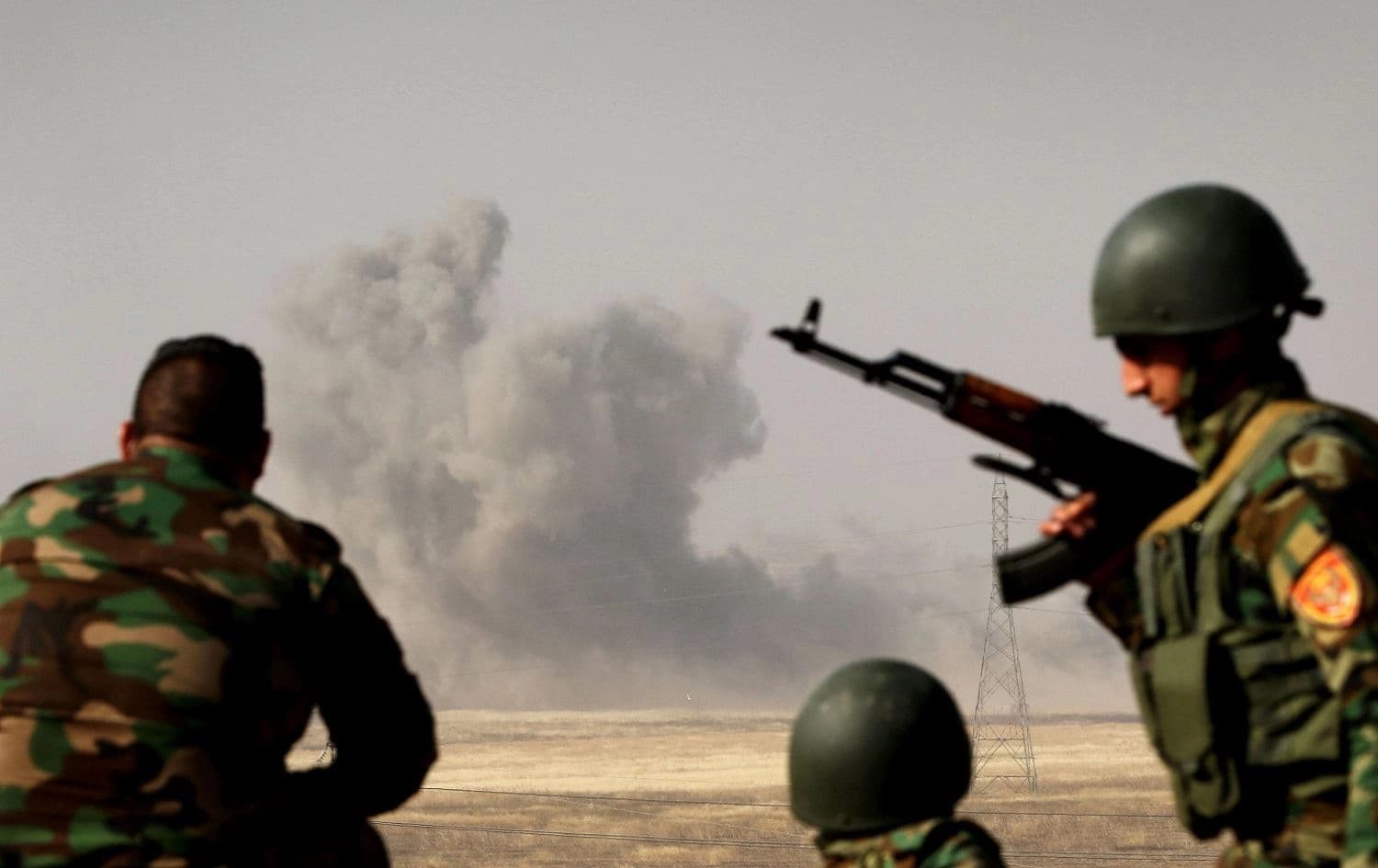 Smoke billows on the front line as Kurdish Peshmerga fighters hold a position near Hasan Sham village, some 45 kilometres east of the city of Mosul, during an anti-ISIS operation, May 29, 2016. File photo: Safin Hamed / AFP 