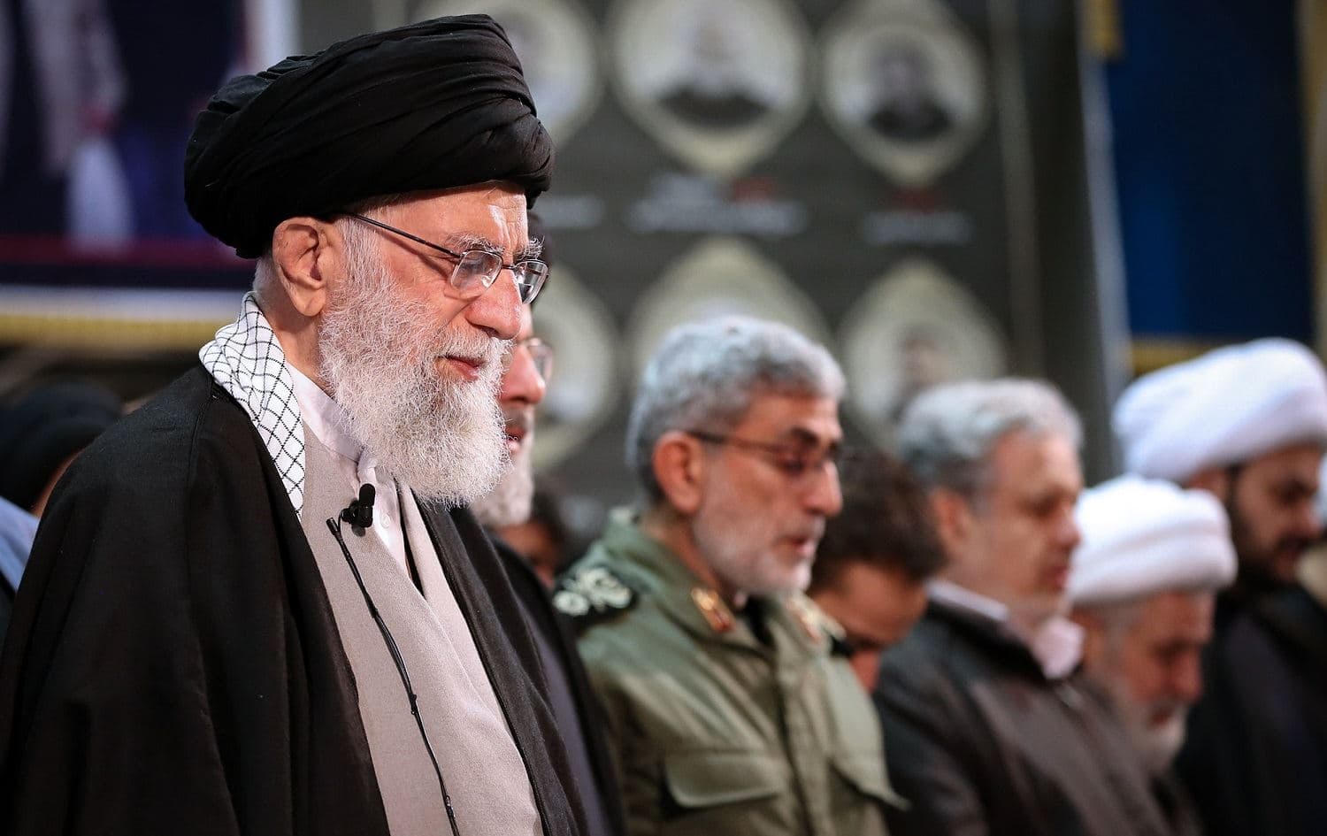 Supreme Leader Ali Khamenei (left) prays over Qasem Soleimani’s body at Tehran University on January 6. New Quds Force commander Esmail Qaani can be seen third from left. Photo: Khamenei.ir 