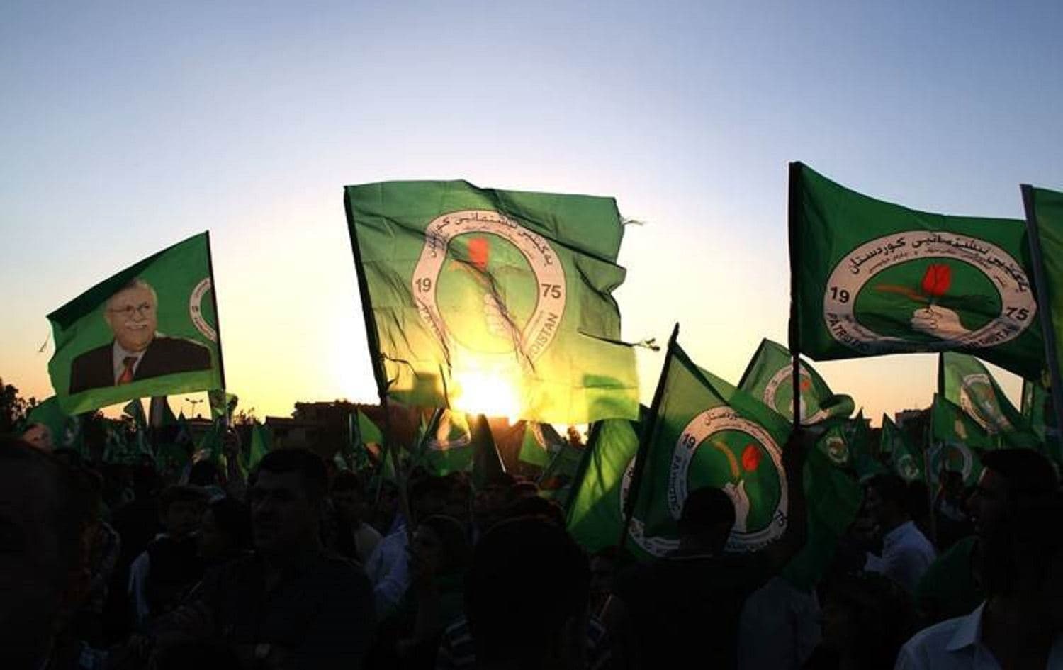 PUK supporters wave party flags. File photo: Rudaw