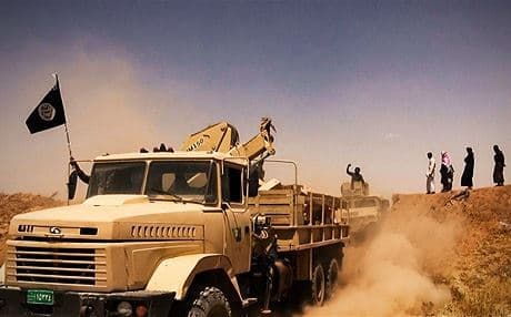 ISIS fighters driving captured Iraqi army trucks in Nineveh province. Photo: ISIS media 