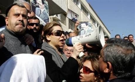 Saddam Hussein’s daughter Raghad, seen here at a protest in 2007, says she is joyous at seeing the Iraqi government defeats at the hands of Islamic militants.  Photo: AP