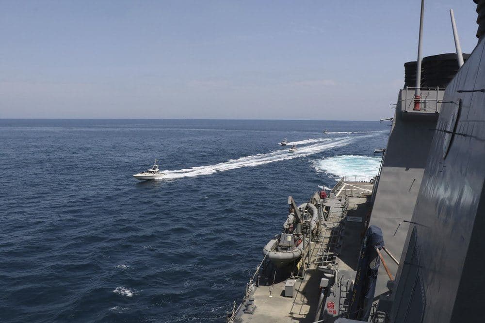 In this Wednesday, April 15, 2020, photo made available by U.S. Navy, Iranian Revolutionary Guard vessels sail close to U.S. military ships in the Persian Gulf near Kuwait. Photo: US navy via AFP