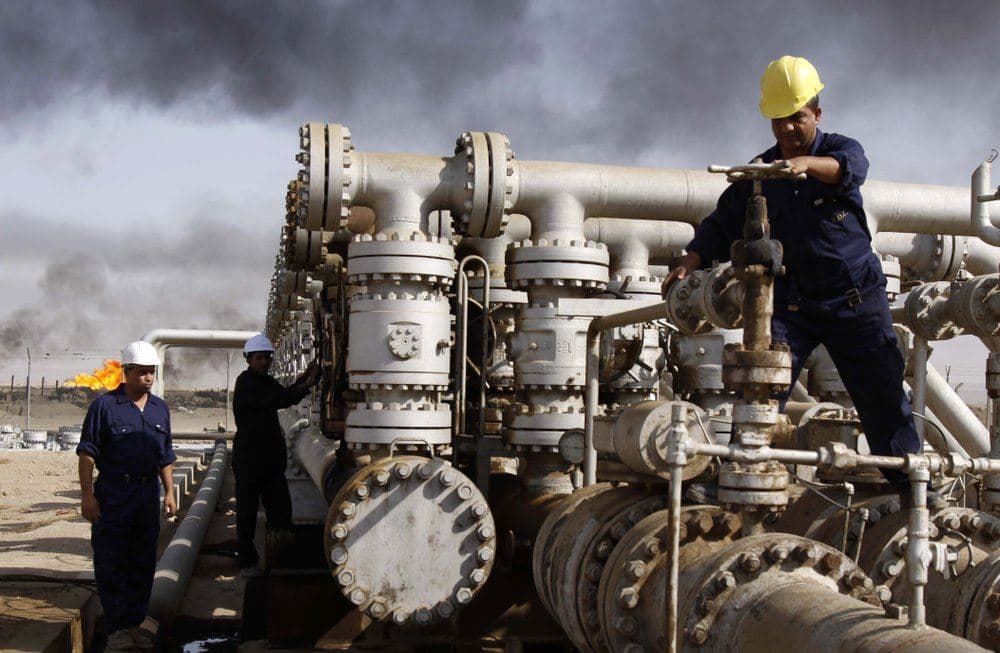 Men work at the Rumaila oil refinery near the Iraqi city of Basra on December 13, 2009. File photo: Nabil al-Jurani / AP