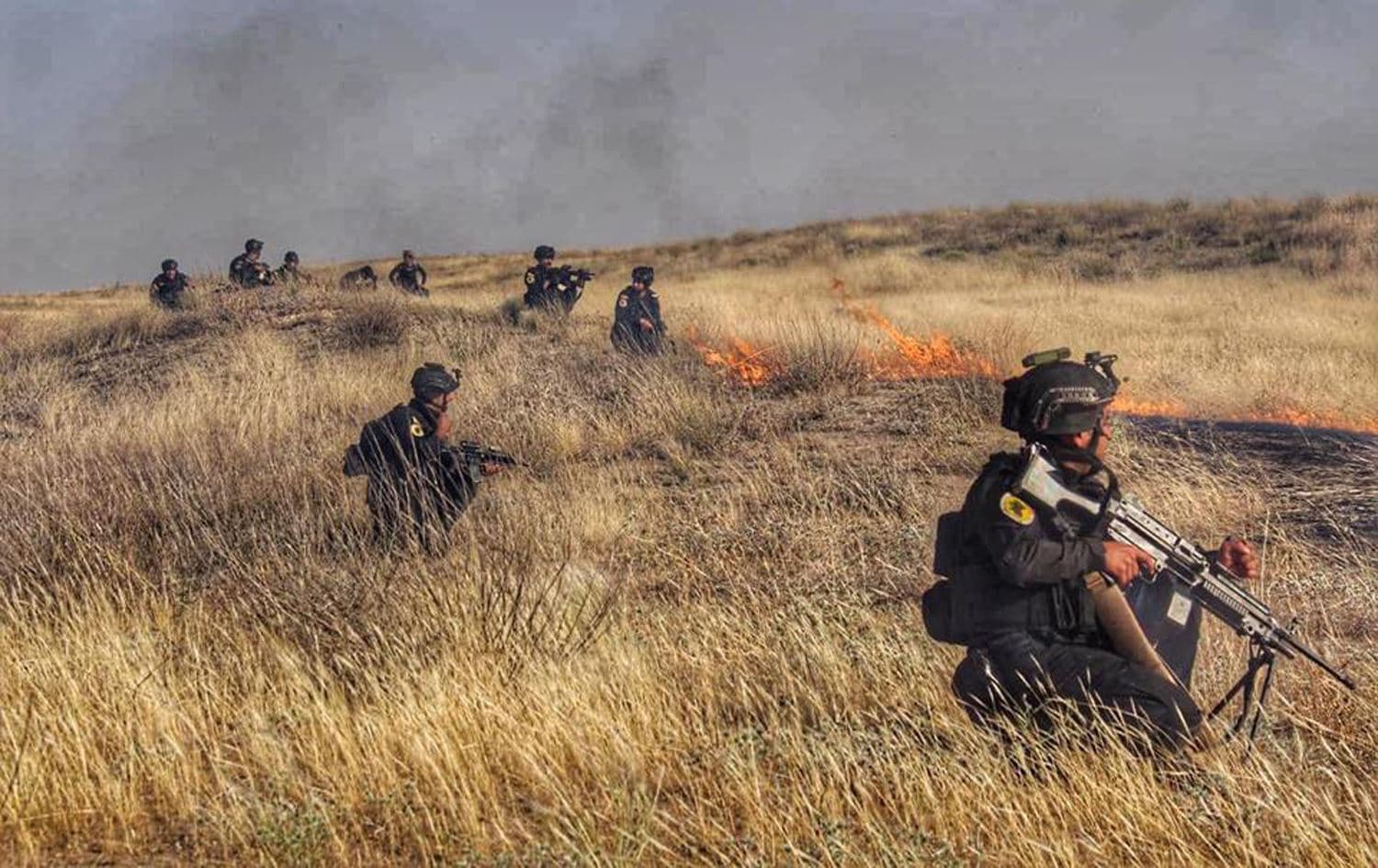 Iraqi Counter-Terrorism Service (ICTS) personnel advance across a field near Dibis, south of Kirkuk, May 18, 2020. Photo: ICTS / social media 