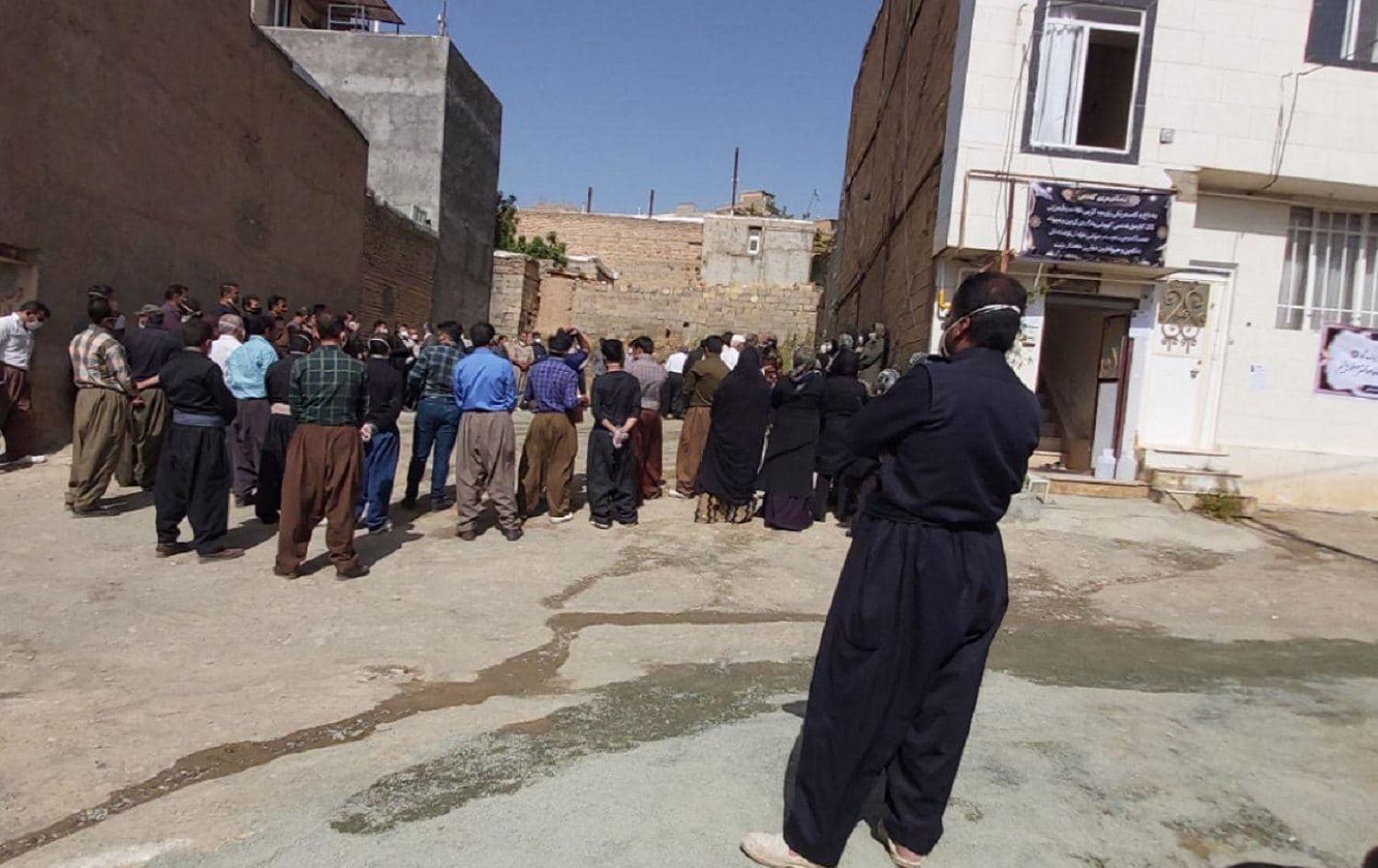 Mourners gather in an alleyway in the Iranian Kurdish city of Sanandaj, western Iran. Photo: Rudaw