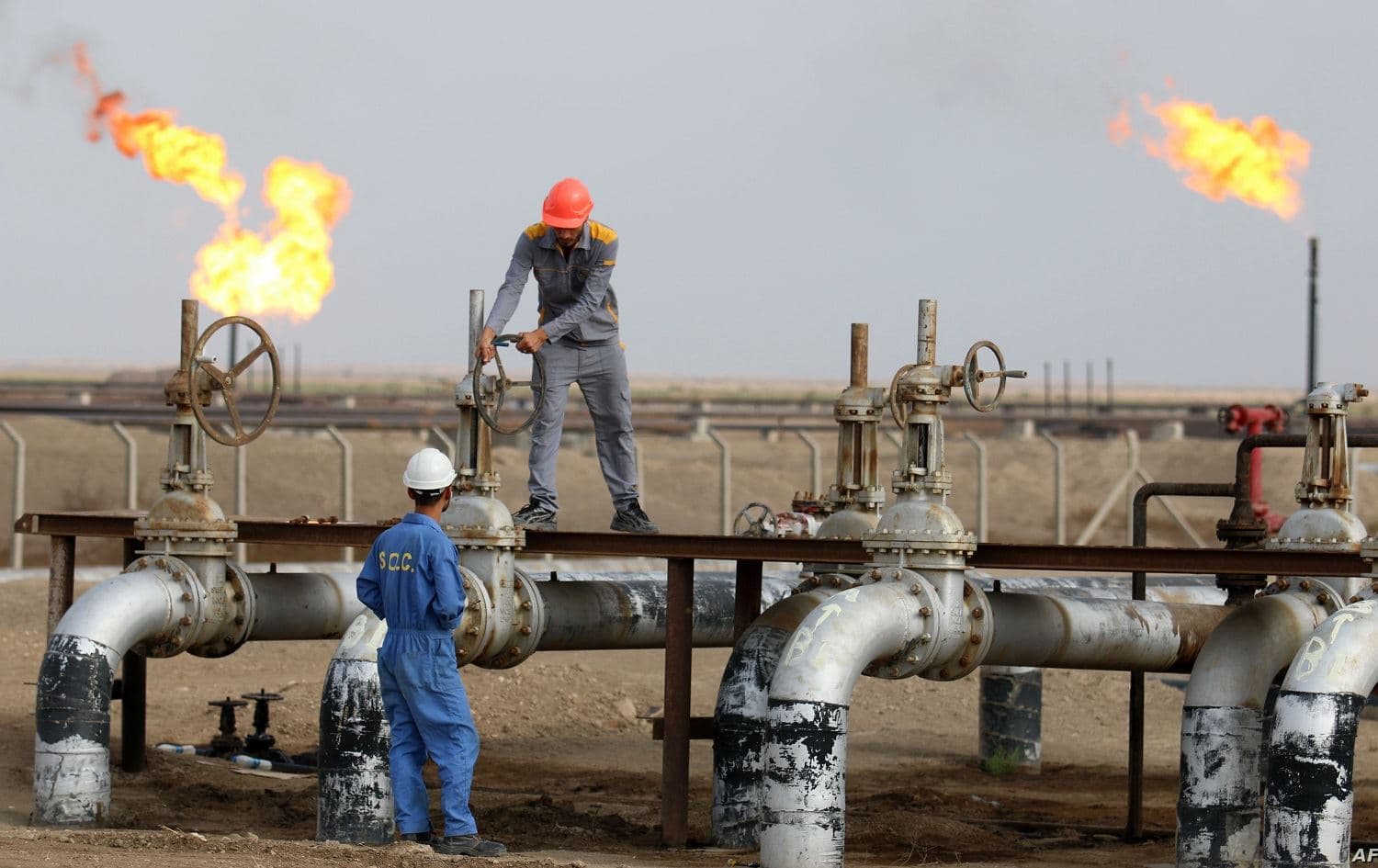 Workers at an oil refinery in Nasiriya, southern Iraq. File photo: AFP 
