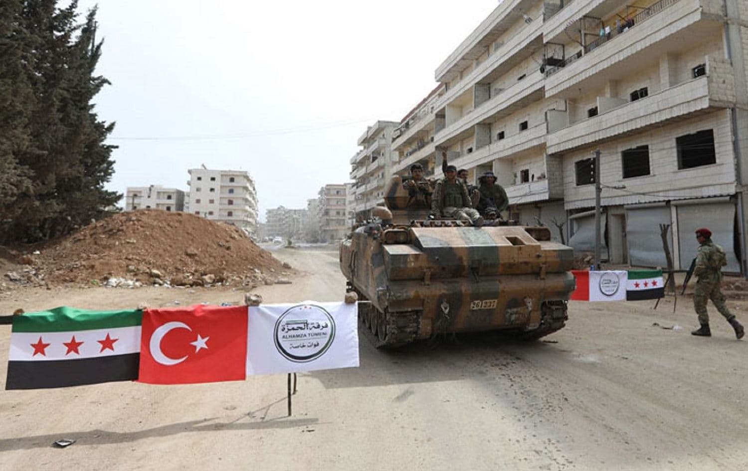 Turkish-backed fighters man a checkpoint in the northwest Syrian town of Afrin in March 2018. File photo: AFP