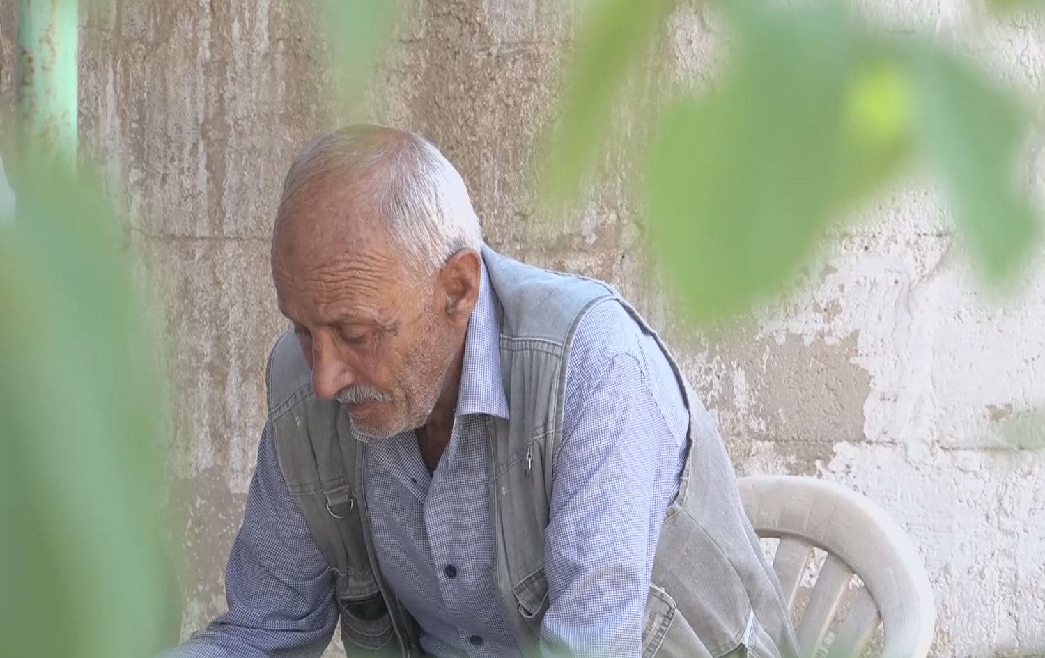 Dibo Rasho, whose brother Mohammed went missing in 2013, sits at the family home in Amuda, northeast Syria on 29 June 2020. Photo: Rudaw 