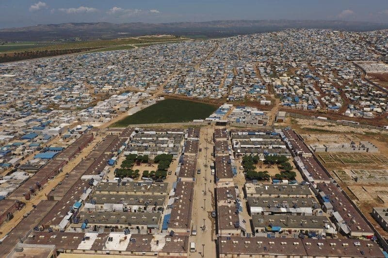 This April 19, 2020 photo file photo shows a large refugee camp on the Syrian side of the border with Turkey, near the town of Atma, in Idlib province, Syria. Photo: Ghaith Alsayed / AP
