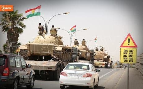 Kurdish Peshmerga forces passing through Kirkuk on their way to defense lines south of the province, June 26. Photo: Rudaw