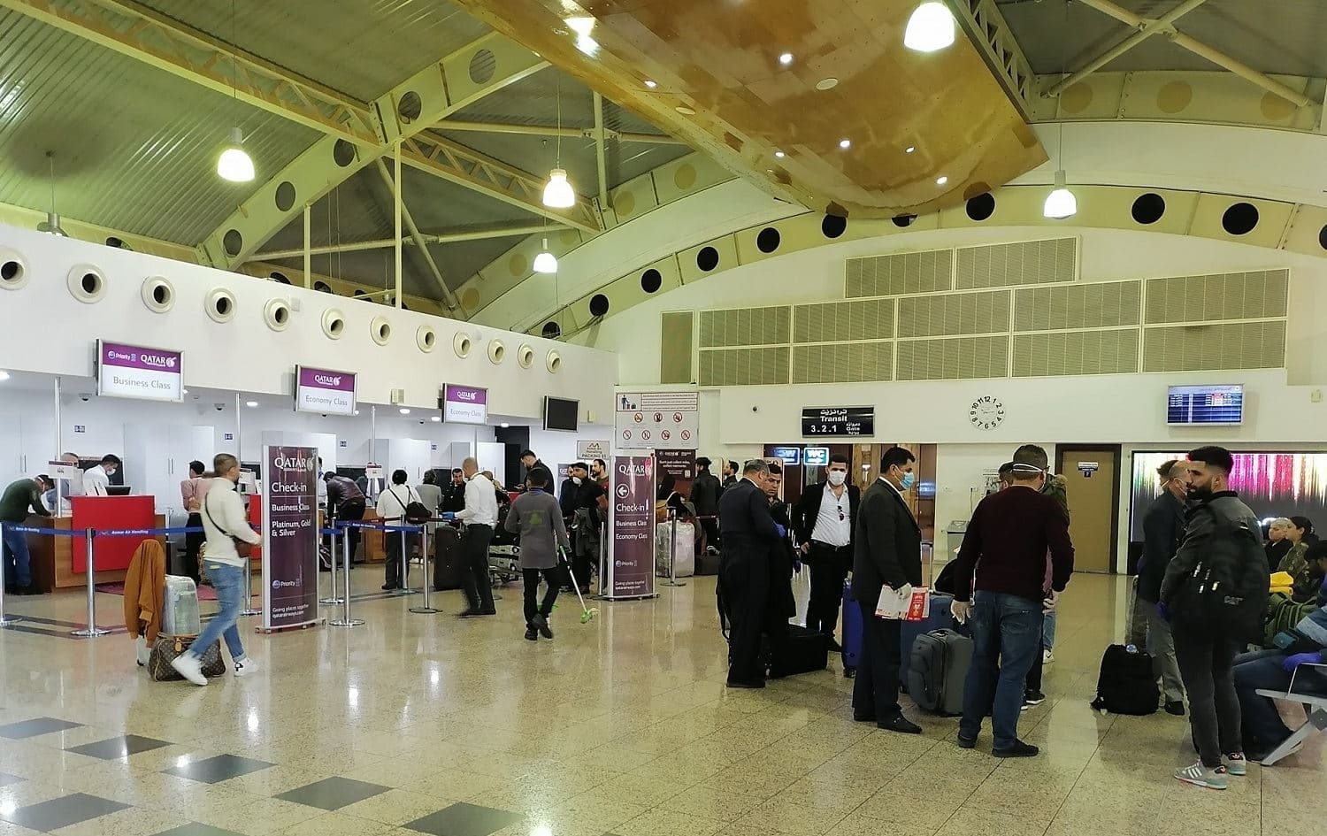 Some of the last passengers to travel through Sulaimani International Airport wear masks on March 15, 2020. Photo: Sulaimaniyah International Airport