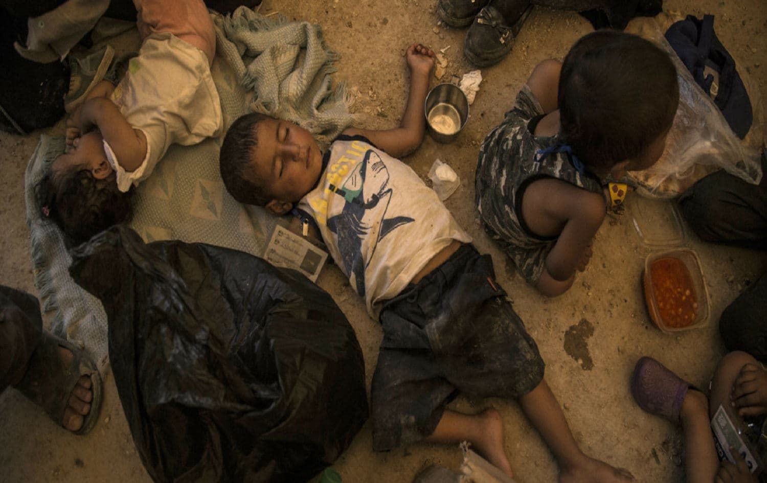 Women and children related to fighters of the Islamic State in an overcrowded al Hol camp wait to return to their homes. Hasakeh province, Syria. June 3, 2019. Photo: Baderkhan Ahmad / AP