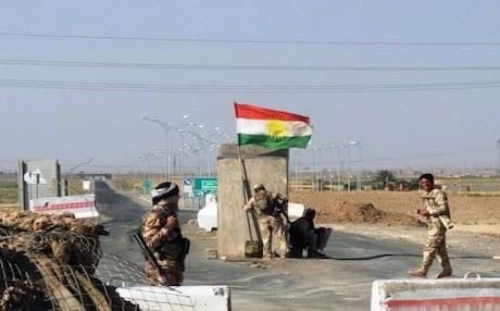 Kurdish Peshmerga forces guarding checkpoint on the main road between Kirkuk and Tikrit. Photo: AFP