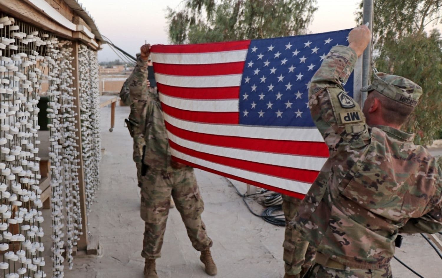 US forces take down their flag at Iraq’s Taji Military Complex on August 22, 2020. Photo: handout/Capt. Aaron Moshier/New Jersey National Guard