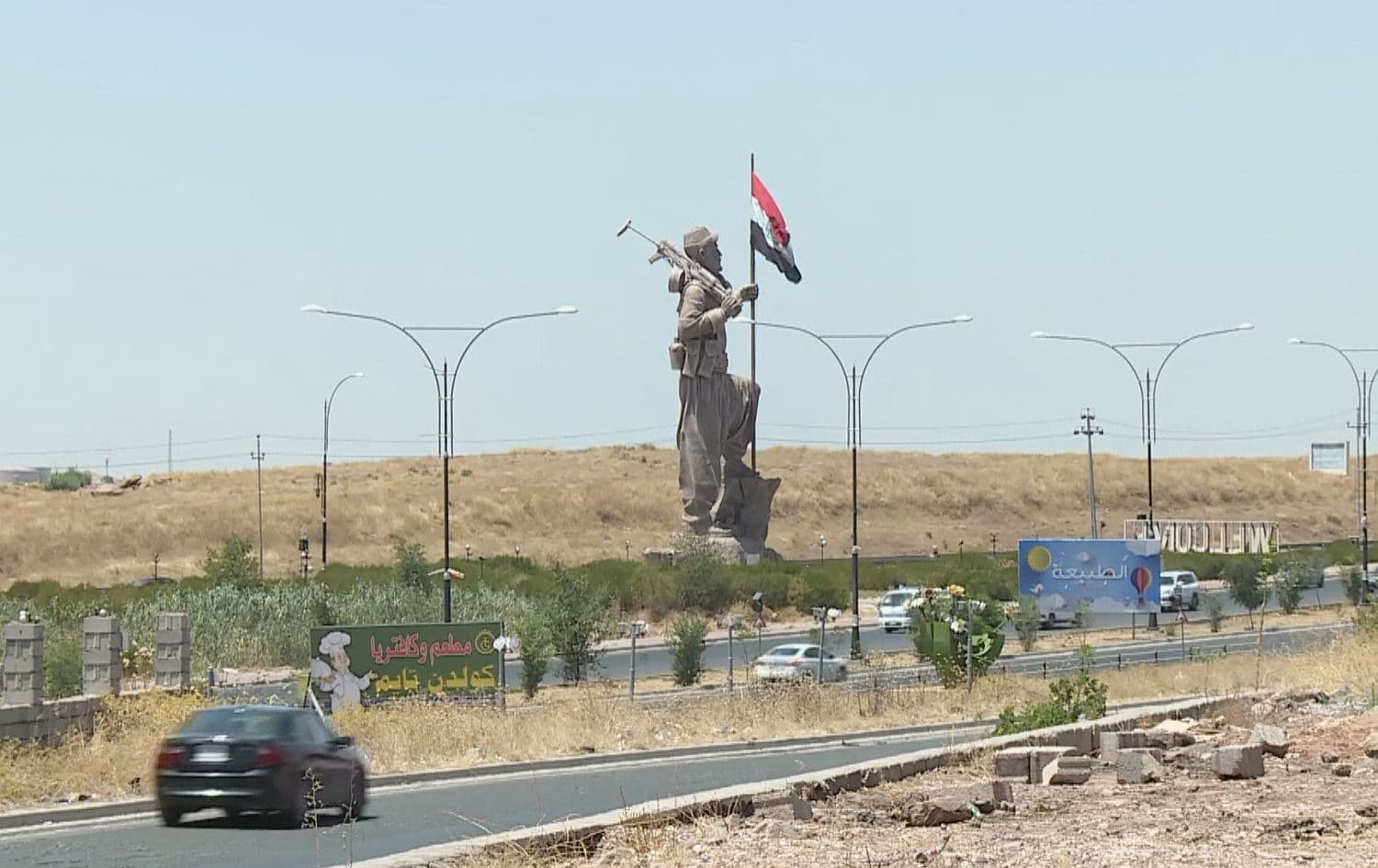 The Iraqi flag flies in the hands of Kirkuk city's Peshmerga statue on September 12, 2020. Photo: Rudaw TV