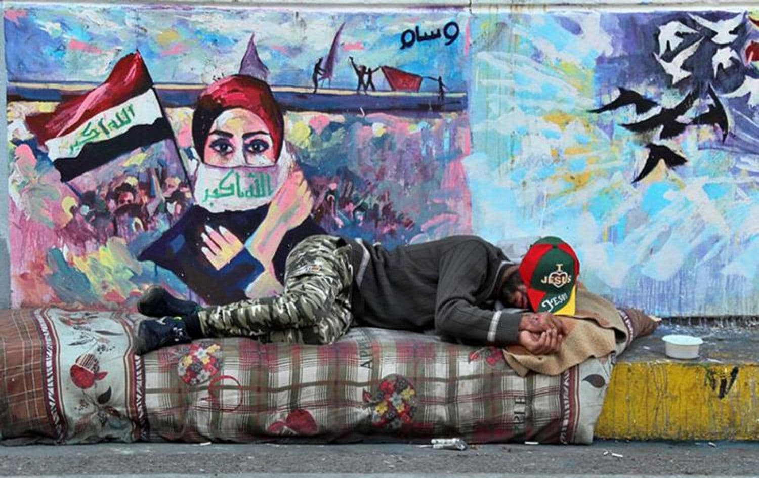 An Iraqi protester rests in Baghdad’s Tahrir Square on December 4, 2019. File photo: AP