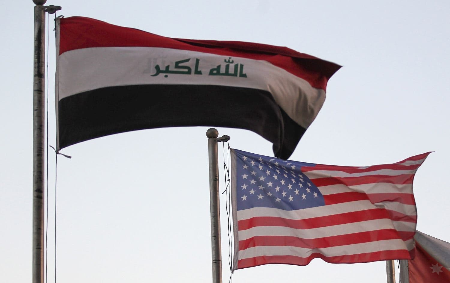 The Iraqi and US flags sway in the wind outside a hotel in the Iraqi capital Baghdad on September 27, 2020. Photo: Ahmad al-Rubaye / AFP