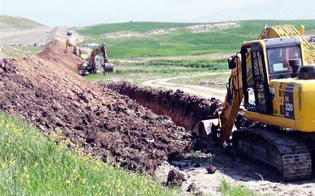 Bulldozers at work on digging the trenches. Photo: Rudaw