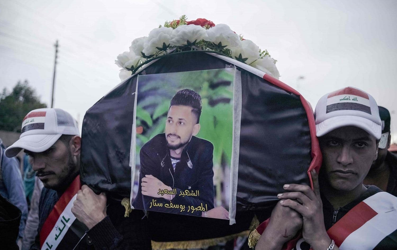Mourners gather in Baghdad in January 2020 for journalist Yussef Sattar. Photo: Ayman Henna