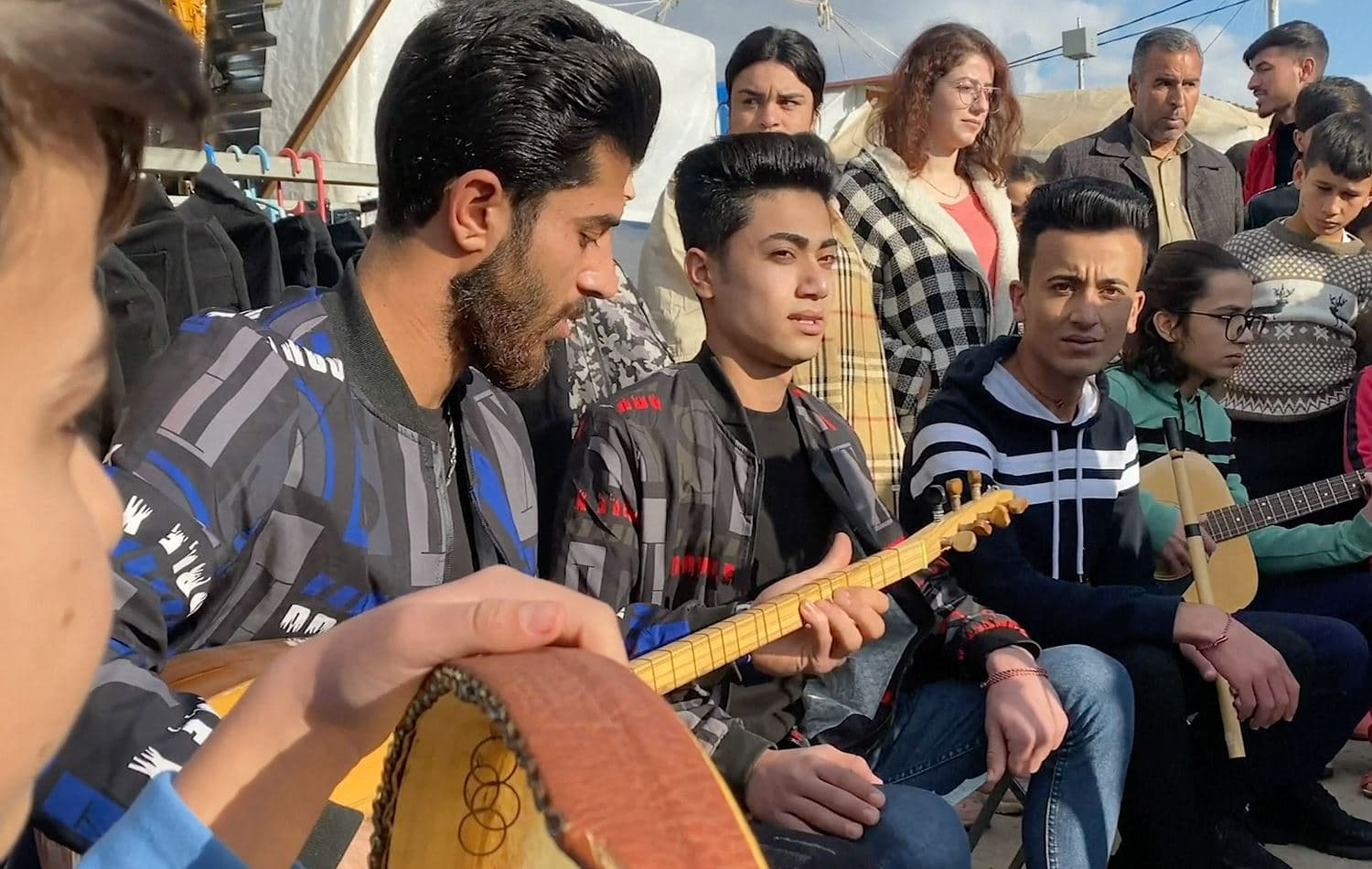 Yazidi family band play for Duhok camp IDPs